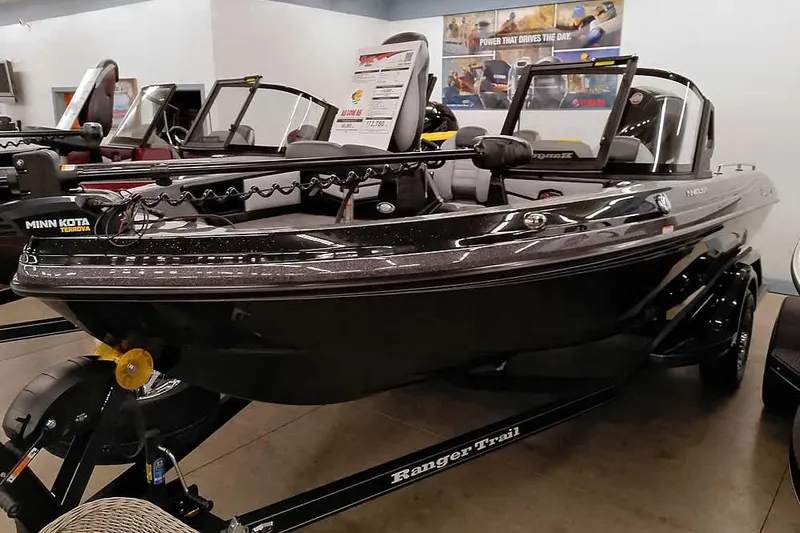 Slide: The Image of 2026 Ranger 1880MS Angler boat displayed indoors, featuring Minn Kota Terrova motor. - 14
