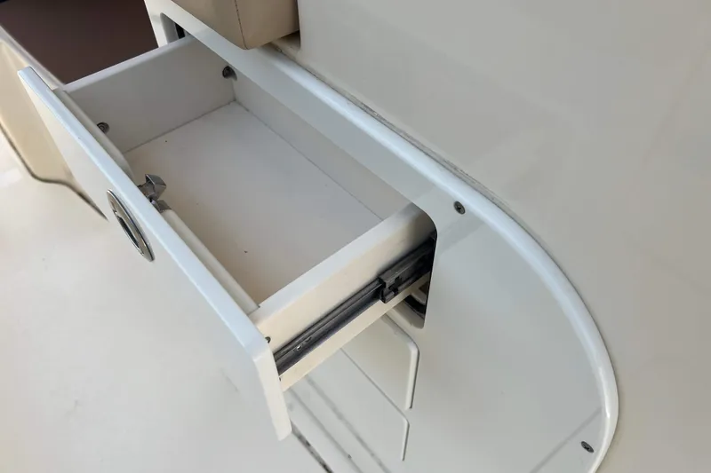 Slide: The Image of Open storage drawer on 2021 Scout 305 LXF boat, showcasing sleek design and functionality. - 23