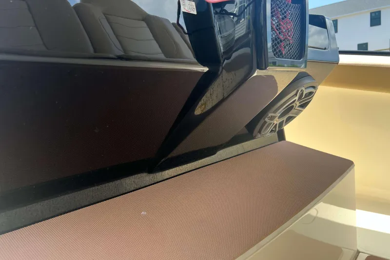 Slide: The Image of 2021 Scout 305 LXF boat interior with speaker and seating detail. - 34