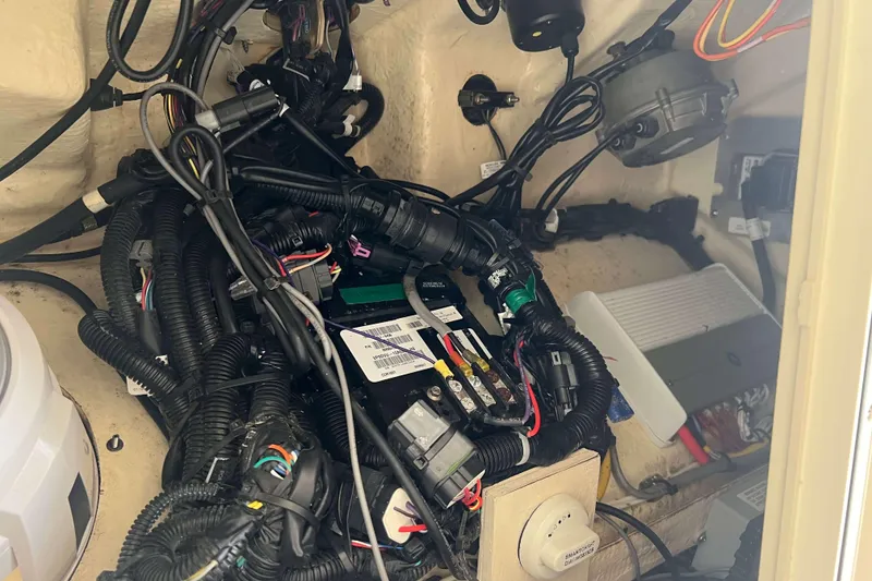 Slide: The Image of 2021 Scout 305 LXF boat wiring and electrical components in engine compartment. - 41