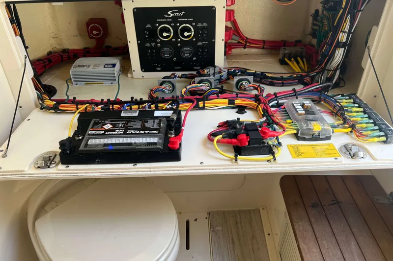 Slide: The Image of 2021 Scout 305 LXF boat electrical system with battery and wiring setup. - 43