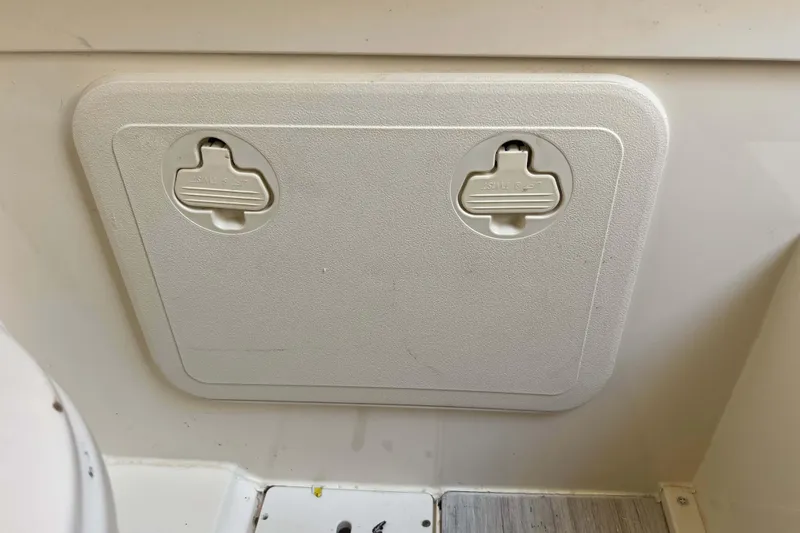 Slide: The Image of Hatch cover on 2021 Scout 305 LXF boat interior. - 44