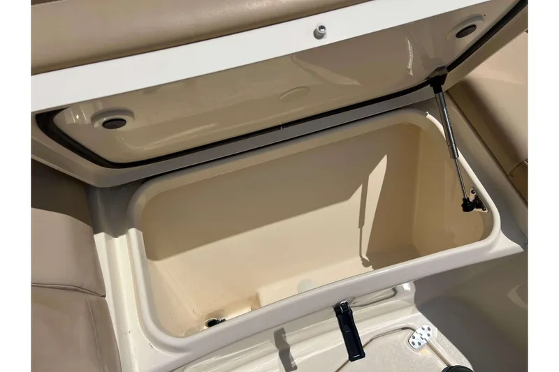 Slide: The Image of Open storage compartment on a 2021 Scout 305 LXF boat, showcasing interior space. - 52