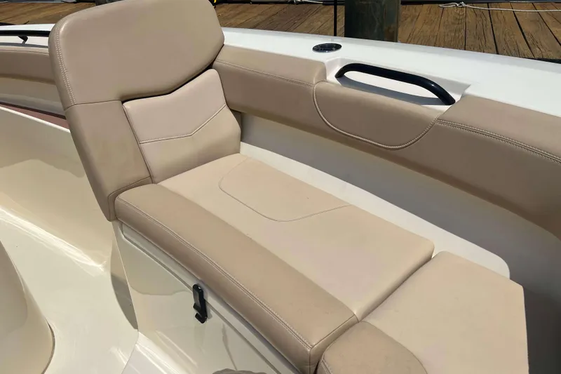 Slide: The Image of 2021 Scout 305 LXF boat with beige seating and sleek design. - 55