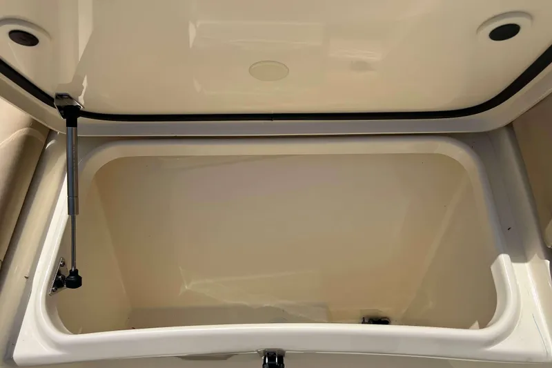 Slide: The Image of Open storage compartment on 2021 Scout 305 LXF boat, showcasing interior space. - 56