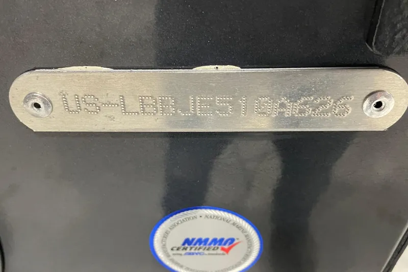 Slide: The Image of 2026 Lund 1650 Rebel XL SS boat on trailer in storage facility. - 7