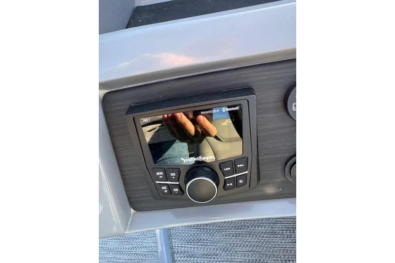 Slide: The Image of Control panel of a 2022 Bennington 23LFB boat with Rockford Fosgate audio system. - 16