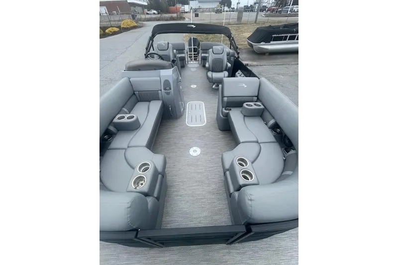 Slide: The Image of 2022 Bennington 23LFB pontoon boat with spacious gray seating and cup holders. - 7