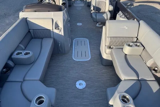 Slide: The Image of 2022 Bennington 23LFB boat interior with gray seating and cup holders. - 8