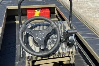 Slide: The Image of 2026 Gator Tail 2060 EXTREME C.C. boat console with steering wheel and controls. - 10