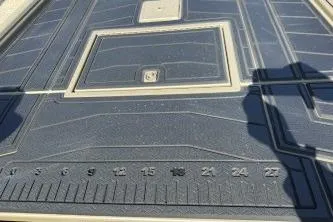 Slide: The Image of 2026 Gator Tail 2060 EXTREME C.C. boat deck with measurement markings and storage hatch. - 6