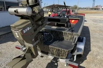 Slide: The Image of 2026 Gator Tail 2060 EXTREME C.C. boat with camouflage design on a trailer. - 7