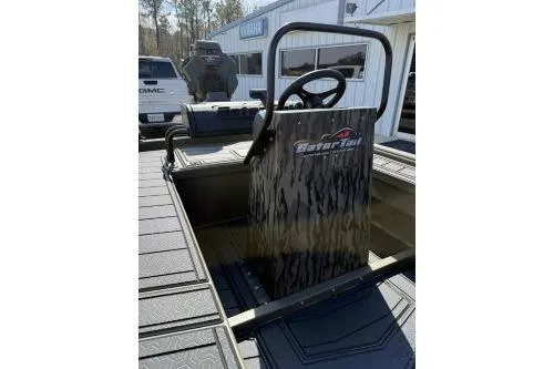 Slide: The Image of 2026 Gator Tail 2060 EXTREME C.C. boat interior with steering console. - 9