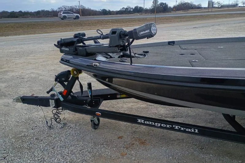 Slide: The Image of 2022 Ranger Z520R boat on trailer with Lowrance equipment, parked on gravel. - 4