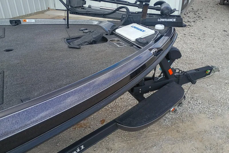 Slide: The Image of 2022 Ranger Z520R boat with Lowrance equipment on a trailer, parked on gravel. - 5