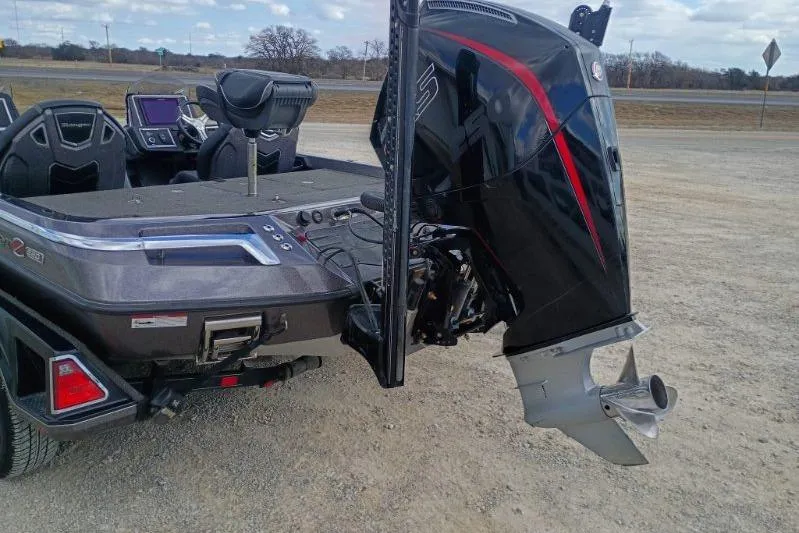 Slide: The Image of 2022 Ranger Z520R boat with powerful outboard motor on a gravel surface. - 7