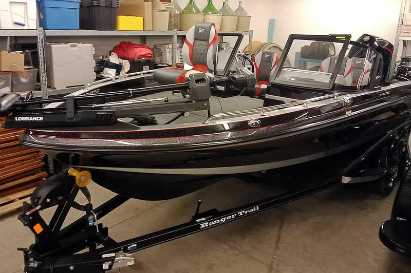 The Image of 2026 Ranger 621FS Fisherman boat in storage, featuring Lowrance equipment and sleek design. - 1