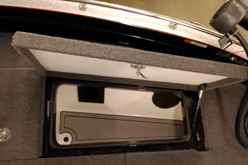 Slide: The Image of Open storage compartment in 2026 Ranger 621FS Fisherman boat, showcasing interior design. - 12