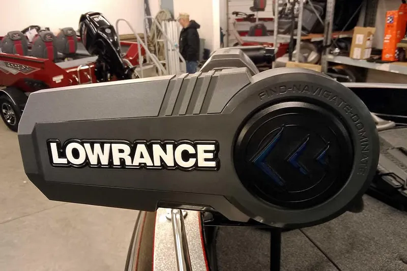 Slide: The Image of Lowrance equipment on 2026 Ranger 621FS Fisherman boat in showroom setting. - 15