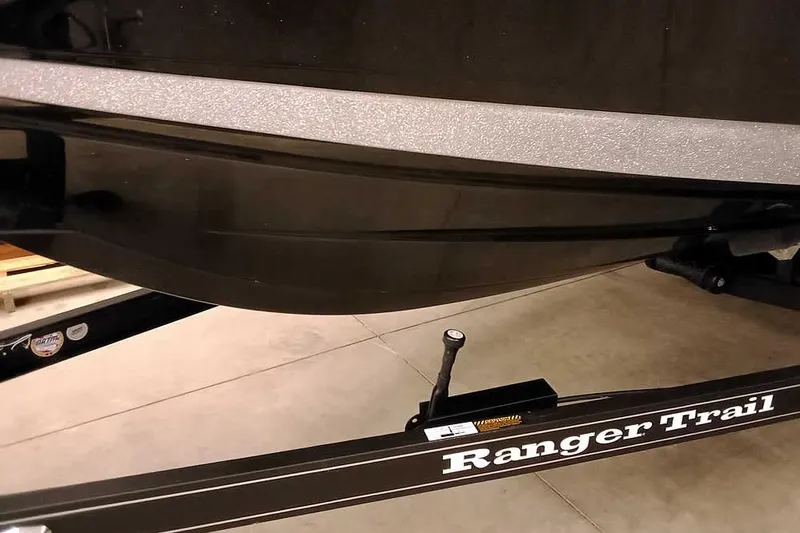 Slide: The Image of 2026 Ranger 621FS Fisherman boat on Ranger Trail trailer in a garage. - 6