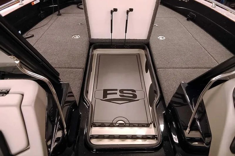Slide: The Image of 2026 Ranger 621FS Fisherman boat interior with storage compartment and carpeted deck. - 9