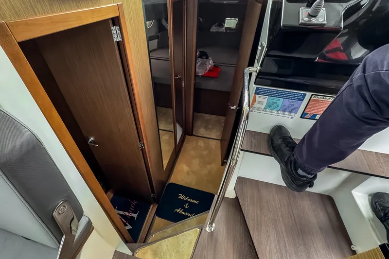 Slide: The Image of Interior view of 2022 Beneteau Antares 11 Fly, featuring stairs and cabin entrance. - 20