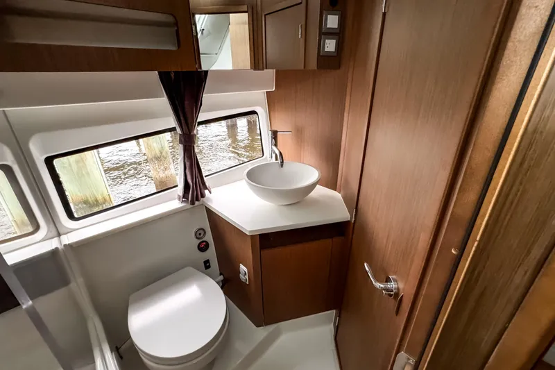 Slide: The Image of Luxurious bathroom interior of 2022 Beneteau Antares 11 Fly yacht with modern fixtures. - 29