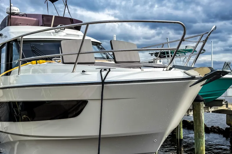 Slide: The Image of 2022 Beneteau Antares 11 Fly yacht docked, showcasing sleek design and modern features. - 3