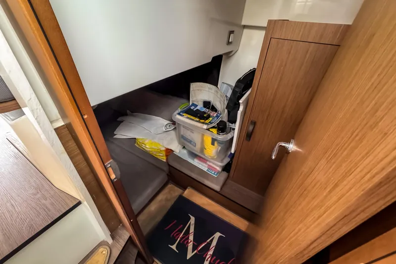 Slide: The Image of Interior cabin of 2022 Beneteau Antares 11 Fly with storage and wooden cabinetry. - 33