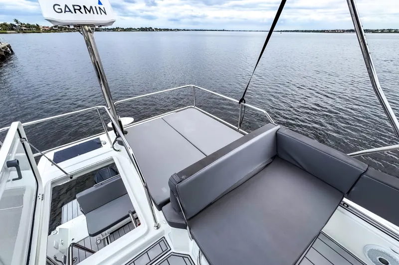 Slide: The Image of 2022 Beneteau Antares 11 Fly deck with seating, overlooking calm waters. - 35