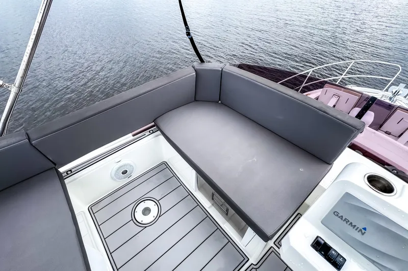 Slide: The Image of Beneteau Antares 11 Fly 2022 boat deck with seating and Garmin equipment. - 36