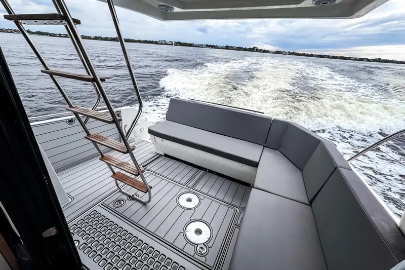 Slide: The Image of 2022 Beneteau Antares 11 Fly boat deck with seating and ocean view. - 5
