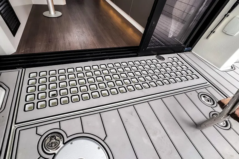 Slide: The Image of Beneteau Antares 11 Fly 2022 yacht deck with modern design and wood flooring. - 9