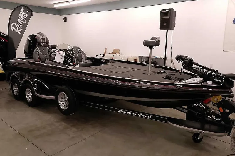The Image of 2026 Ranger Z521R Cup-Equipped boat displayed indoors on a trailer. - 0