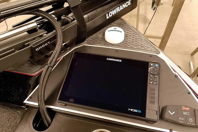 Slide: The Image of 2026 Ranger Z521R Cup-Equipped boat dashboard with Lowrance HDS12 display and Ghost trolling motor. - 12