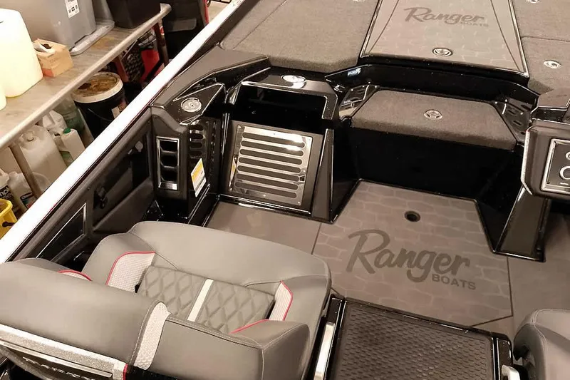Slide: The Image of 2026 Ranger Z521R Cup-Equipped boat interior with premium seating and storage. - 17