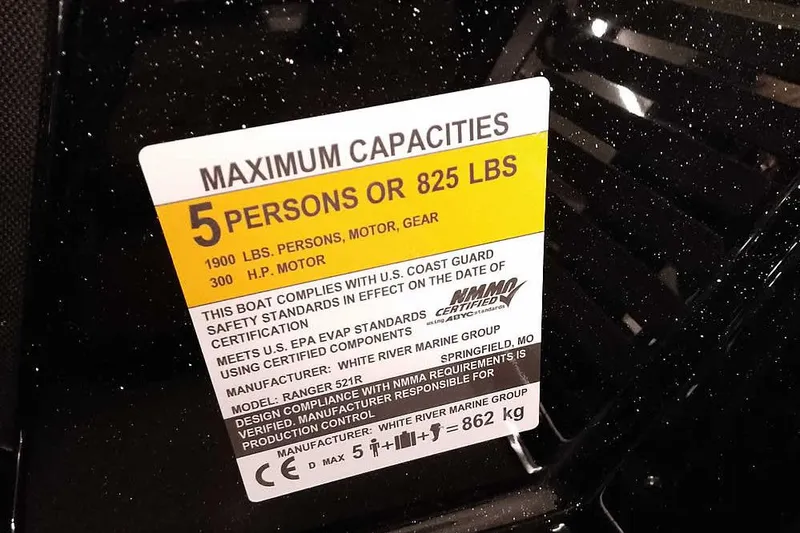 Slide: The Image of 2026 Ranger Z521R Cup-Equipped boat capacity label, 5 persons or 825 lbs, 300 HP motor. - 19
