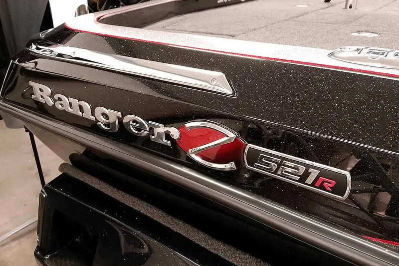 Slide: The Image of 2026 Ranger Z521R Cup-Equipped boat, sleek black design with red accents. - 2