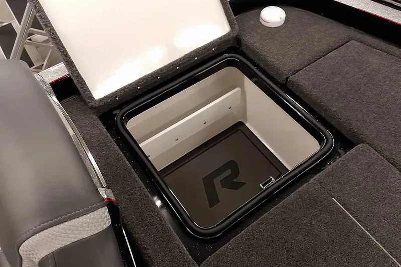 Slide: The Image of 2026 Ranger Z521R Cup-Equipped boat storage compartment with open lid, showcasing interior design. - 27
