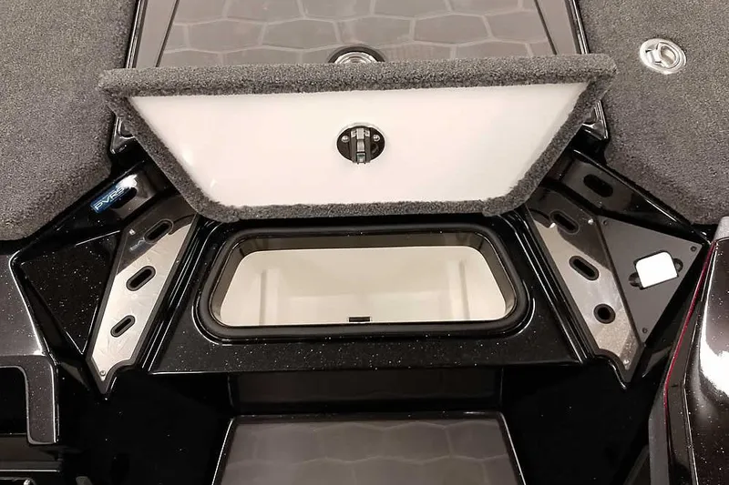 Slide: The Image of 2026 Ranger Z521R Cup-Equipped boat storage compartment, open lid, black and gray interior. - 5