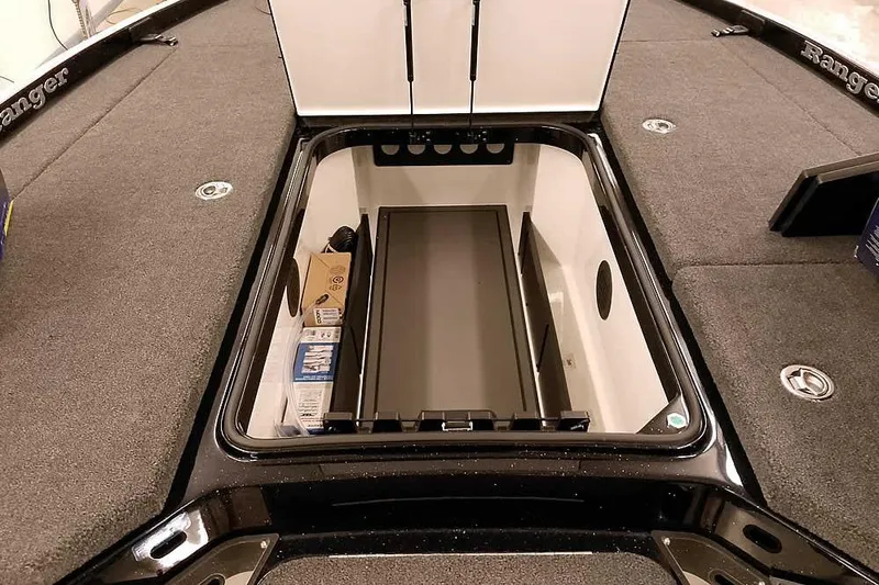 Slide: The Image of 2026 Ranger Z521R Cup-Equipped boat storage compartment with organized interior layout. - 6