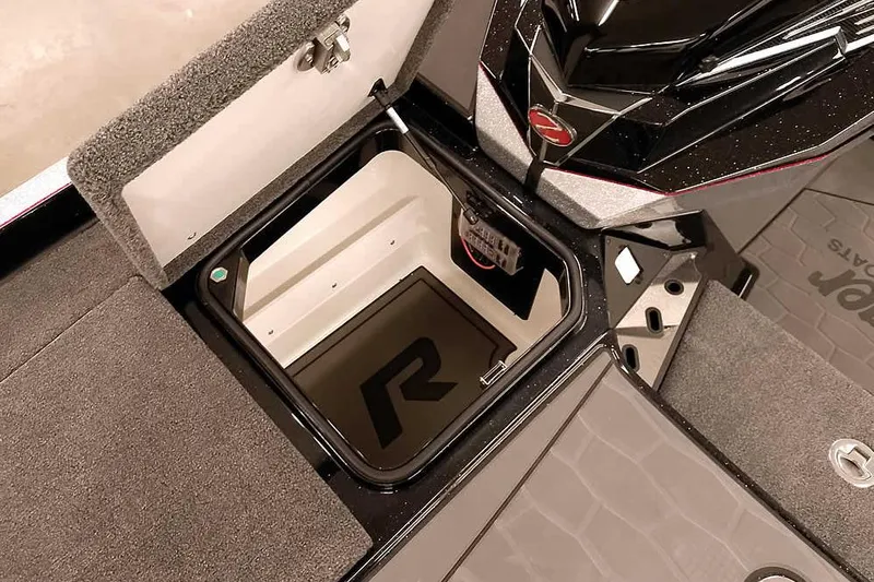 Slide: The Image of 2026 Ranger Z521R Cup-Equipped boat storage compartment with open lid, showcasing interior design. - 7