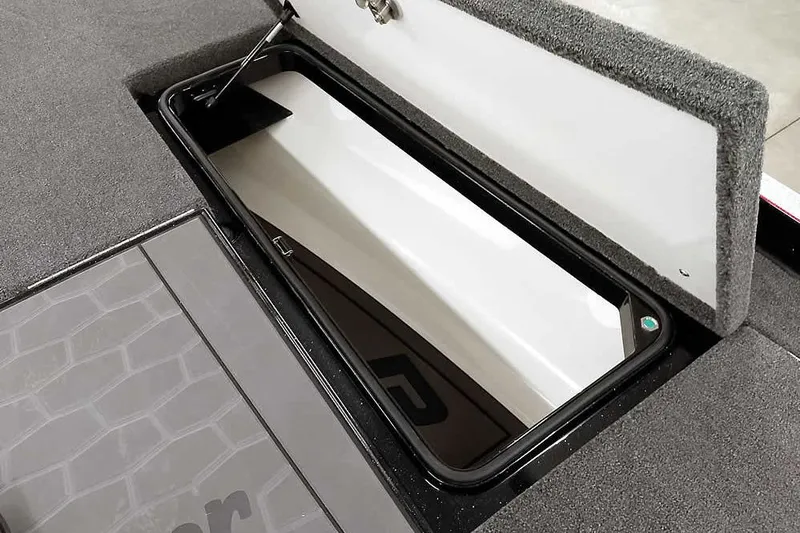 Slide: The Image of 2026 Ranger Z521R Cup-Equipped boat storage compartment with open lid, showcasing interior space. - 8