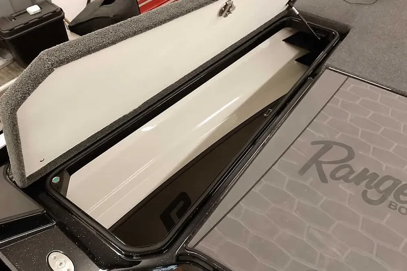 Slide: The Image of Open storage compartment in 2026 Ranger Z521R Cup-Equipped boat. - 9