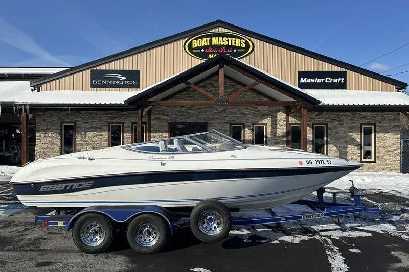 Slide: The Image of 2000 Ebbtide 210 Bow Rider boat on trailer outside Boat Masters dealership. - 1