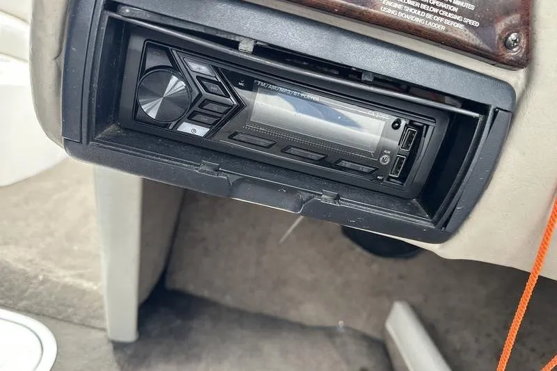 Slide: The Image of 2000 Ebbtide 210 Bow Rider boat stereo system close-up. - 17