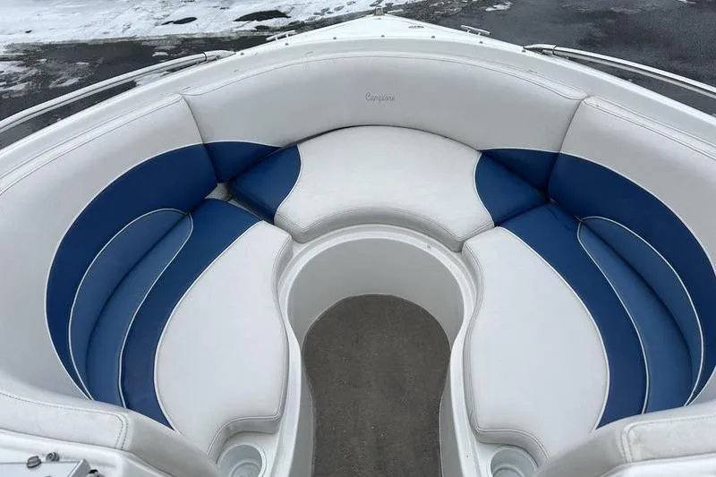 Slide: The Image of Interior of 2000 Ebbtide 210 Bow Rider boat with blue and white seating. - 19