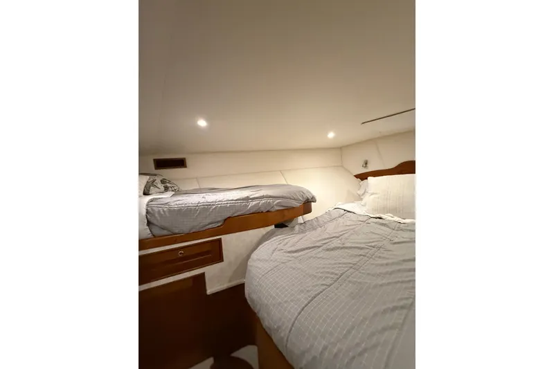 Slide: The Image of Interior cabin of 2006 Blackwell 66 Convertible yacht with cozy twin beds. - 10