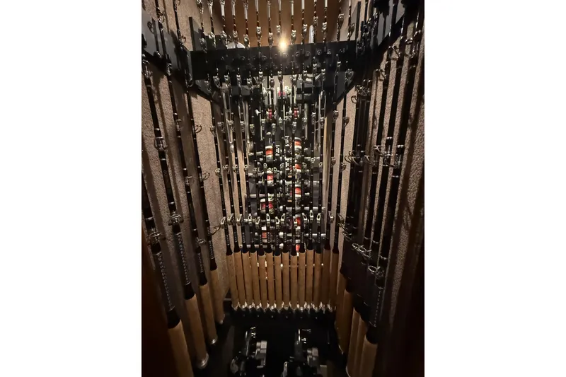 Slide: The Image of Fishing rods neatly stored in a Blackwell 66 Convertible, 2006 model. - 14