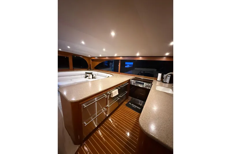 Slide: The Image of Luxurious interior of 2006 Blackwell 66 Convertible yacht with modern kitchen amenities. - 20